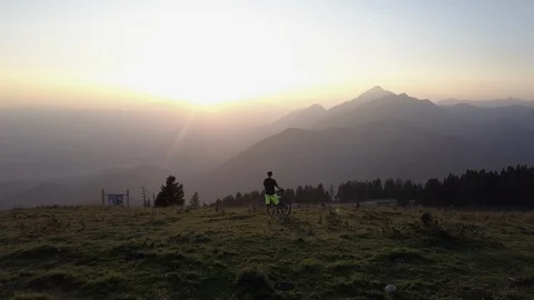 Biker looking at the beautiful sunset Stock Footage 86179484