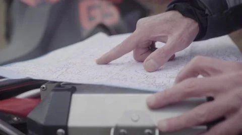 Biker looking at a map Stock Footage 63464782
