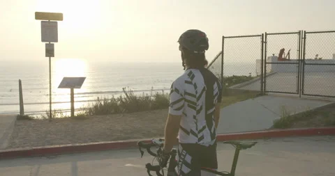 Biker Looking Out into the Ocean Stock-Footage 197346658