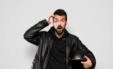 Biker man with surprise expression Stock Photos