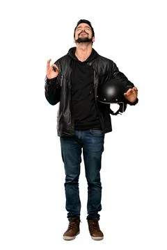 Biker man in zen pose Stock Photos