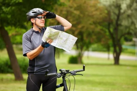 Biker with map Stock Photos