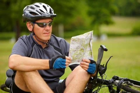 Biker with map Stock Photos