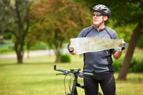 Biker with map Stock Photos