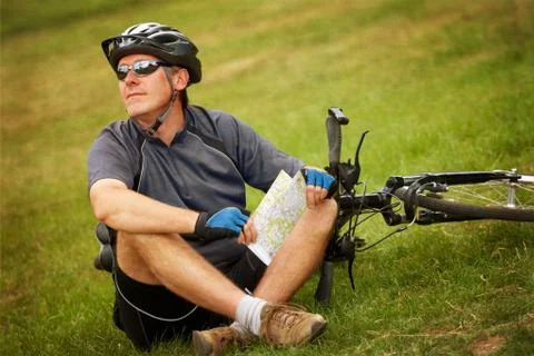 Biker with map Stock Photos