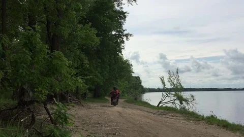 The biker moves across the river. 스톡 동영상 81746293
