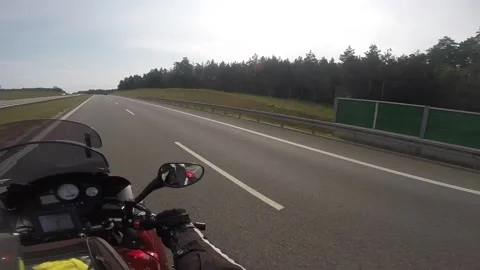 Biker moves on highway Video stock 133834563
