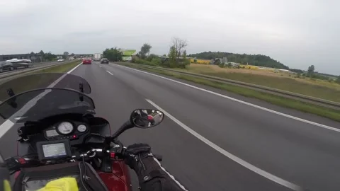 Biker moves on highway Video stock 133834805