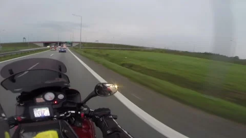 Biker moves on highway Video stock 133925740