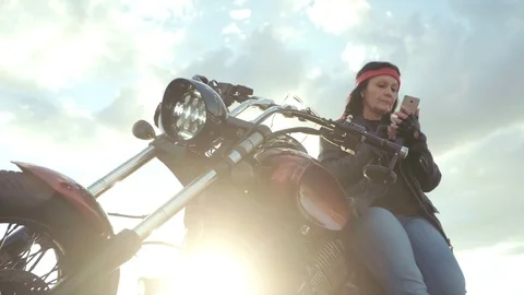 Biker old woman in leather jacket and gl Stock Video Pond5