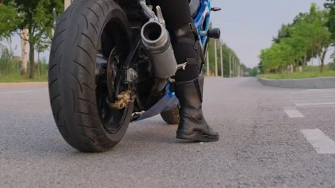 Biker preparing to start moving Video stock 305075315