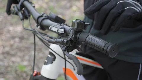 Biker puts hand on steering wheel Stock Footage 129333056