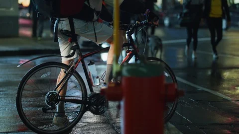 Biker on a rainy night Stock Footage 99916474