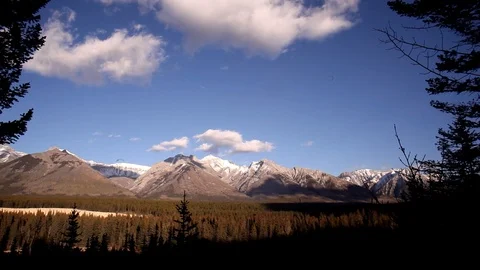 Biker riding with Mountains in Background Stock Footage 101989085