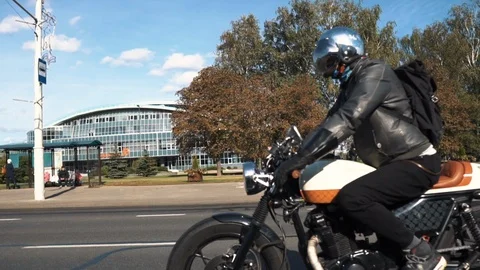 Biker riding old school cafe racer bike Stock Footage 110912732