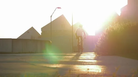 A biker riding into sunset Stock Footage 57346882
