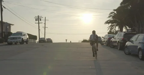 Biker Riding Toward Sunset Stock-Footage 197384520