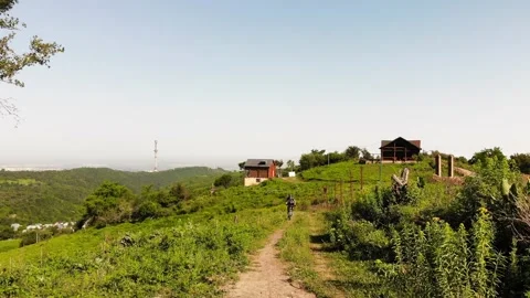 Biker on the road in mountain forest Video stock 131354887