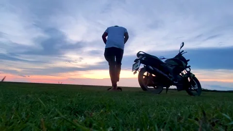 A biker Sit down with bike Stock Footage 275394896