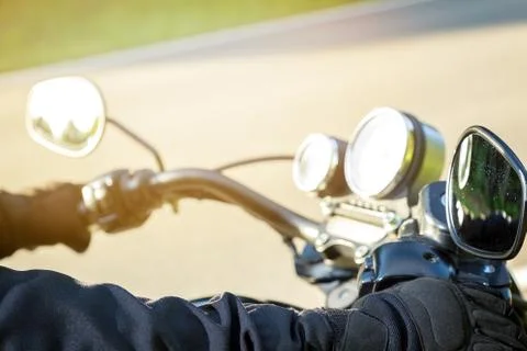 The biker sits on a motorcycle Stock Photos