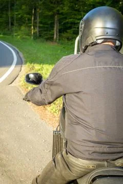 The biker sits on a motorcycle Stock Photos