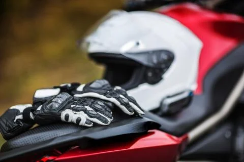 Biker sitting on motorcycle on an empty road, close-up view on hands on Stock Photos