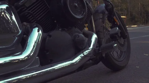 Biker is smoking and using phone on the roadside during road trip Stock Footage 80886937
