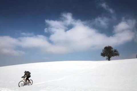Biker in snow Free Stock Photos