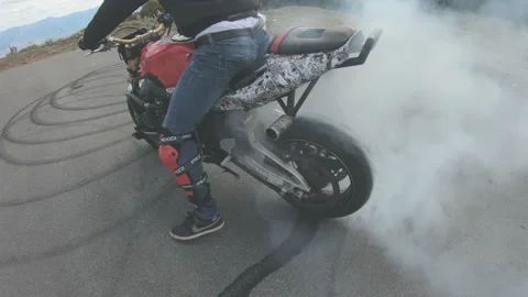 Biker stunt doing dangerous drifting  Stock Footage 202318477