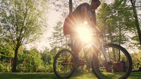 Biker stunt performer effectively performs stunts on a bicycle. Stock Footage 202750310