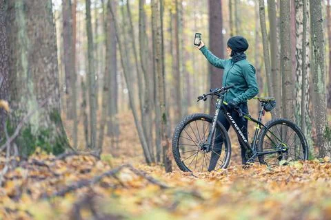 A Biker Taking a Selfie While Enjoying the Beautiful Autumn Forest Scenery Stock Photos