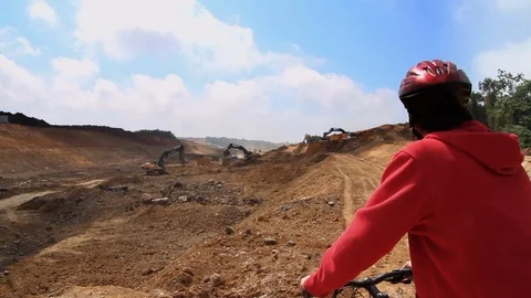 Biker Watching the Deforestation Stock Footage 100367834