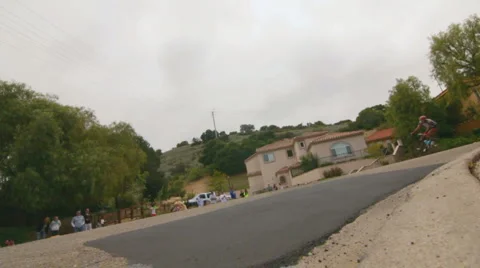 BIKERS CUT CORNER IN SLOW-MOTION Stock Footage 5643392