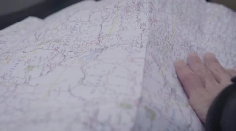 Biker's hand holding a map Stock Footage 63464772