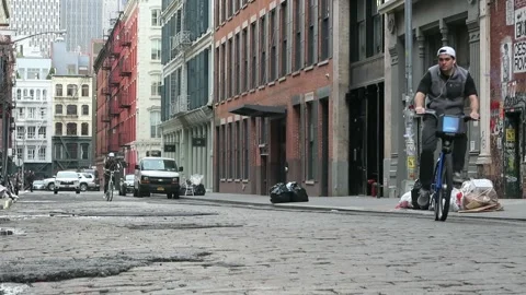 Bikers on soho cobblestone streets Stock Footage 167295878