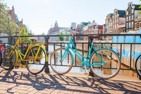 Bikes on the bridge in Amsterdam, Netherlands. Beautiful view of canals in Stock Photos