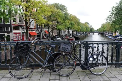 Bikes on the bridge in Amsterdam Stock Photos