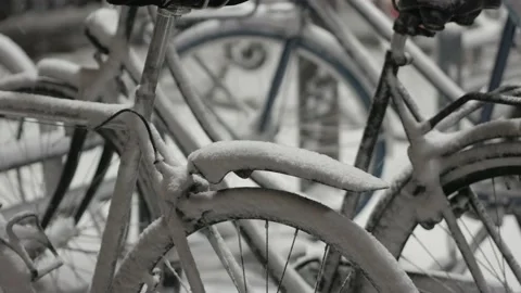 Bikes covered by fresh snow Stock Footage 148566809