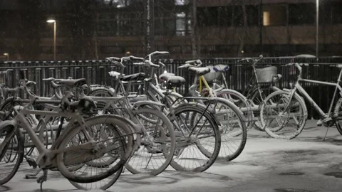 Bikes covered by fresh snow Stock Footage 148566867