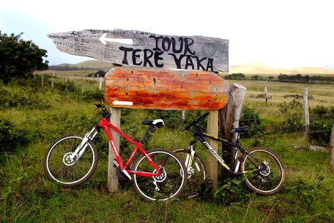 Bikes in front of a sign on Easter Island, Chile Stock Photos