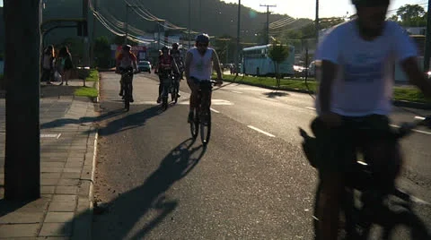 Bikes go down the hill in traffic (PoAbikes40) Stock Footage 23734960