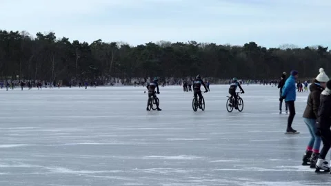 Bikes on ice and skaters Stock Footage 148628740