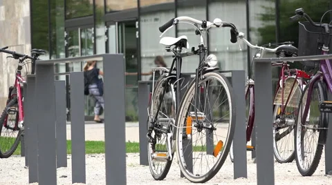 Bikes locked to posts on university campus 4k Stock-Footage 48202333