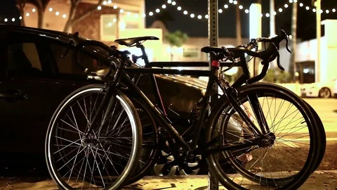Bikes Locked to Street Post Stock Footage 78553049