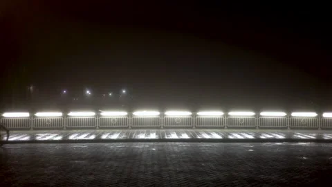 Bikes at night on bridge in the mist Stock Footage 145156508