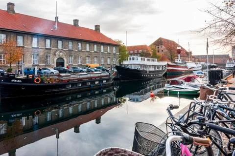 Bikes parked on elevated pavement along Frederiksholm Kanal Stock Photos