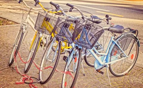 Bikes parked on the pavement. Stock Photos