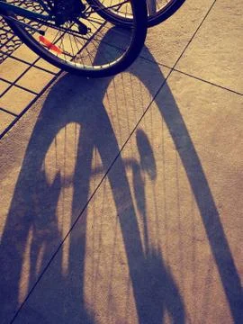 Bikes in parking with shadows Stock Photos