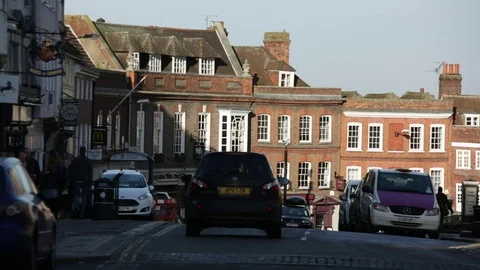 Bikes riding through the heart of Windsor in England Stock Footage 70524329