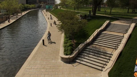 Biking Along White River Canal in City of Indianapolis Stock Footage 125048089